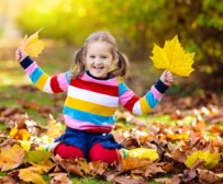 Child playing in leaves3